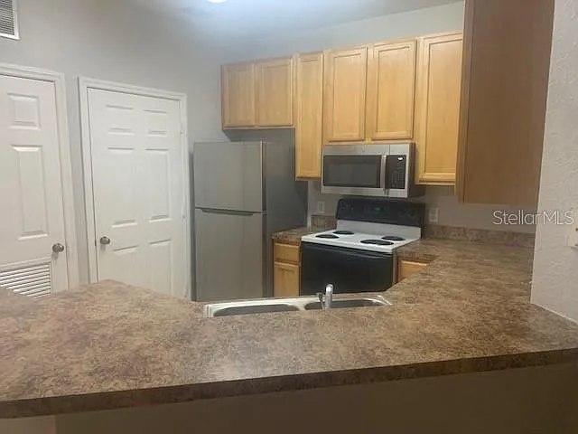 10025 Courtney Palms Blvd #204 — Photo 11