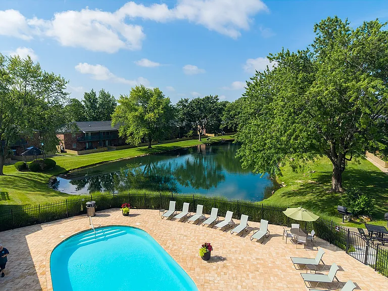 Swimming Pool with Sundeck near Serene Community Pond