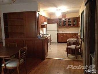 The dining area is separate yet open to the kitchen and the livi