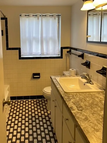 Main bathroom. Tub/shower to the left. Classic 1950's style!