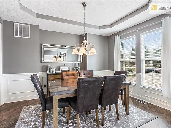 The Dining Room features hardwoods and wainscoting.