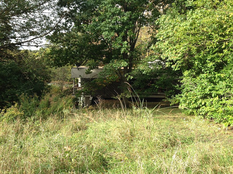 House in its wooded setting.