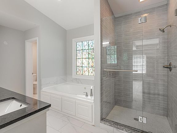 Brand new everything including all surfaces in this master bathroom and the others as well.