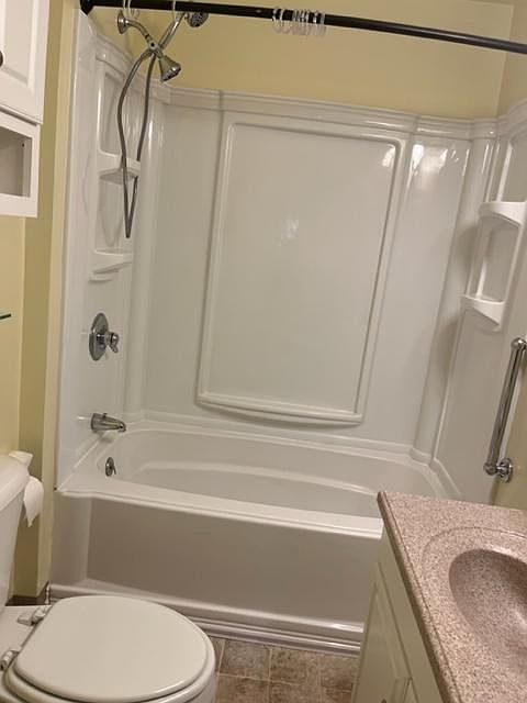 Lots of shelving in the tub surround.