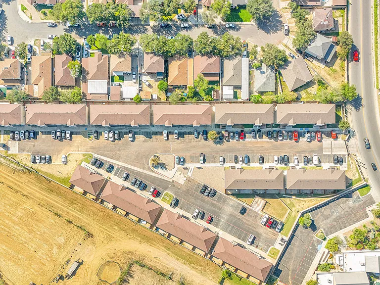 Overhead view of Merida Vista Apartments, highlighting the residential neighborhood and nearby amenities in Laredo, Texas