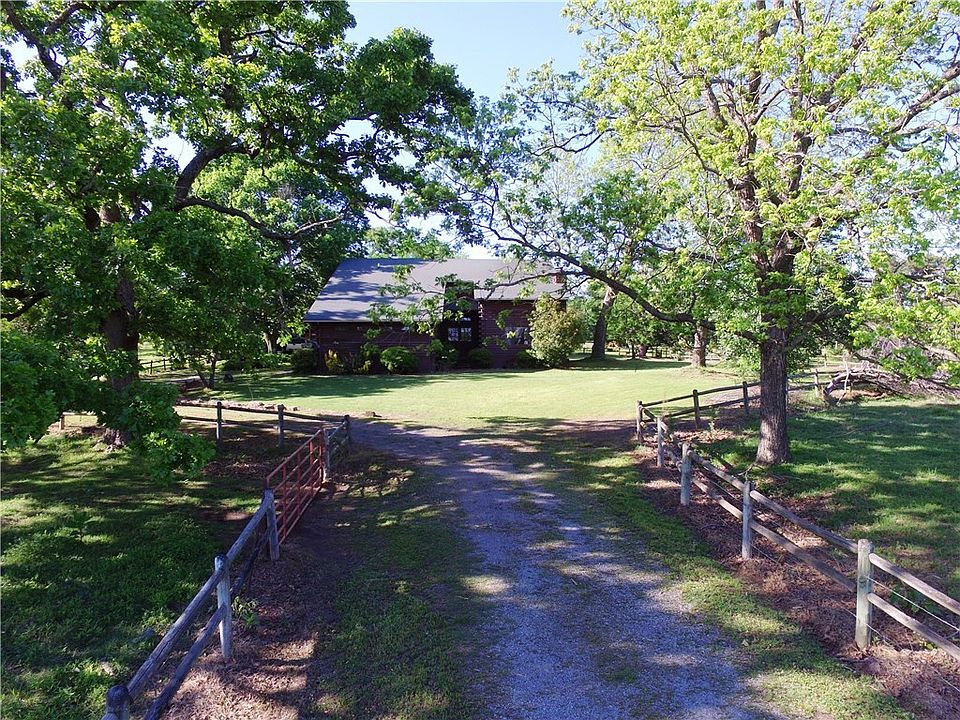PEACEFUL COUNTRY...long driveway lined by rail fence.
