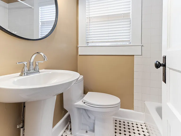 Main Floor Bathroom Well-appointed main floor bathroom with classic and updated materials for everyday convenience in a renovated 1948 home.