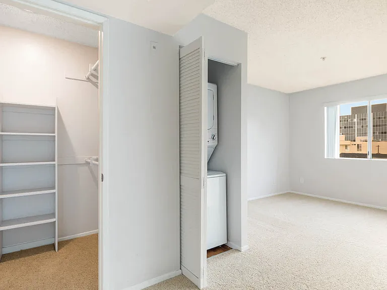 Carpeted Bedroom and In-home Washer and Dryer