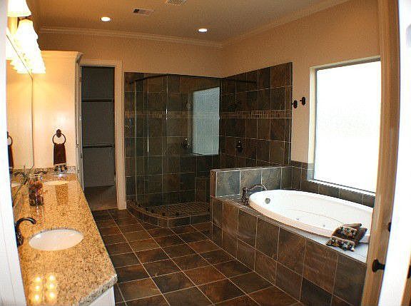 Master bath w/ granite countertops and tile floor