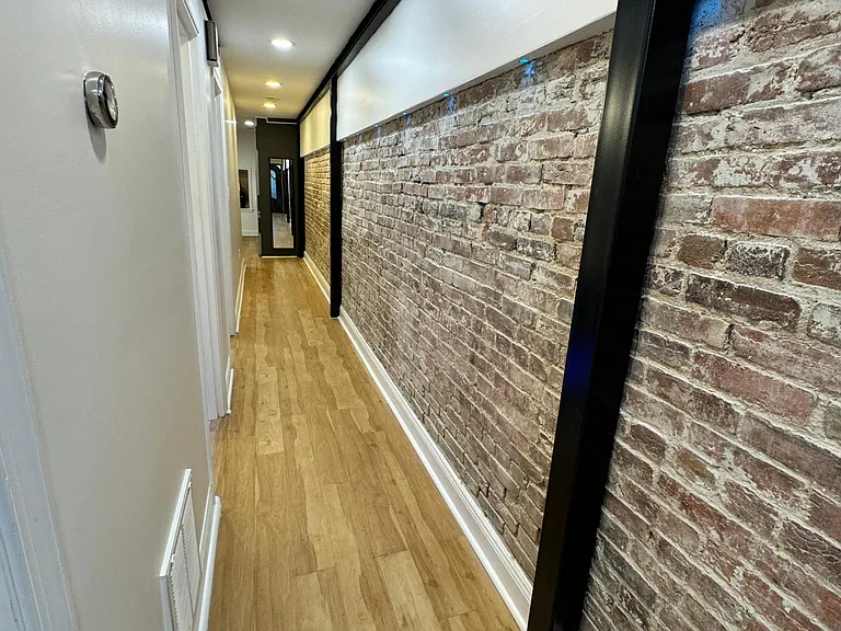 hallway facing the kitchen area