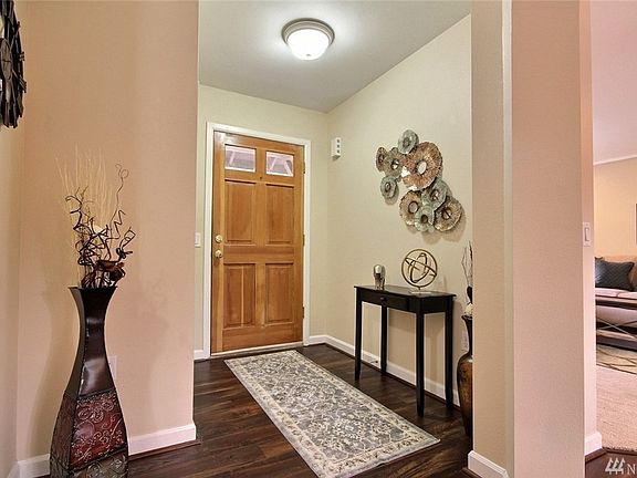Elegant entryway with large coat closet straight ahead.