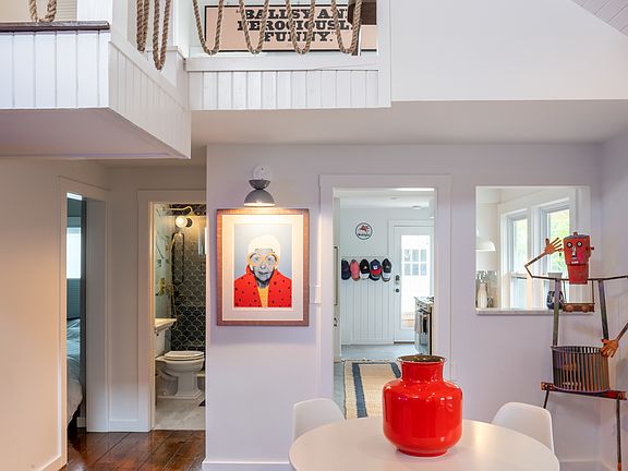 First floor area includes a dining area, kitchen, full bathroom, bedroom and access to the backyard area