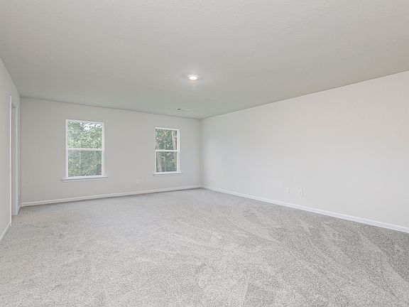 This expansive master bedroom offers plenty of space for all of your furniture