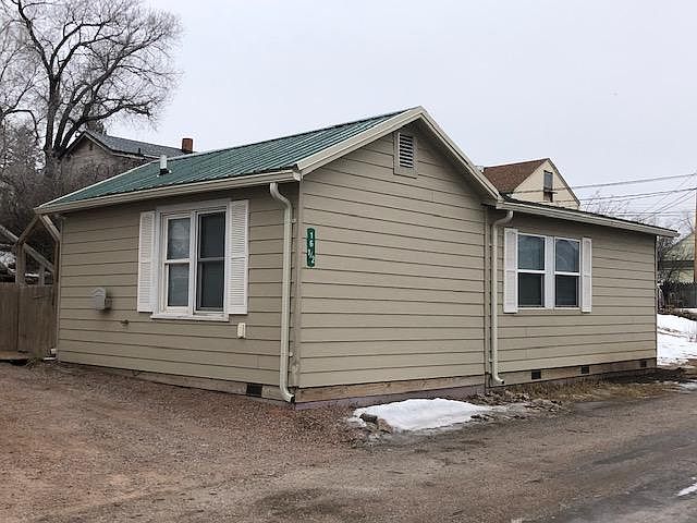 Exterior w new steel roof & gutters