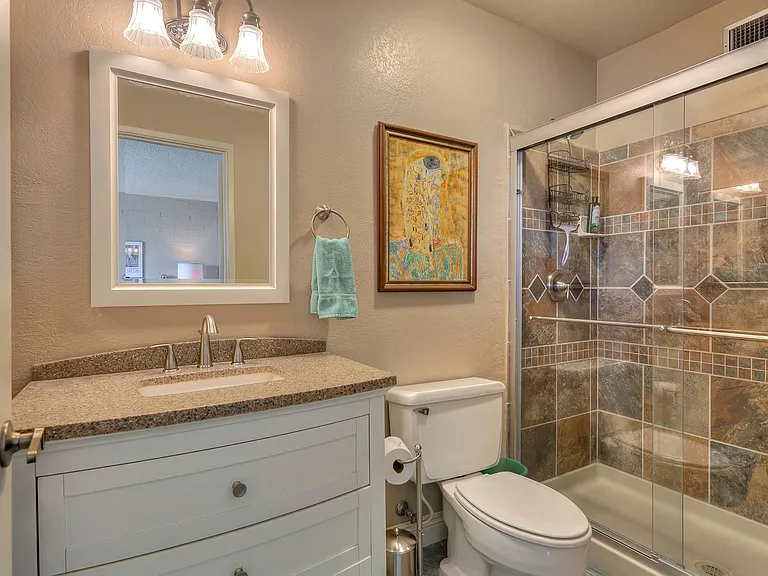 Tiled shower in master bath.