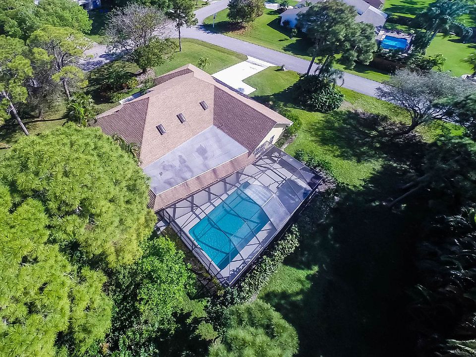 Oversized half acre lot with private, lush lanscaped back yard