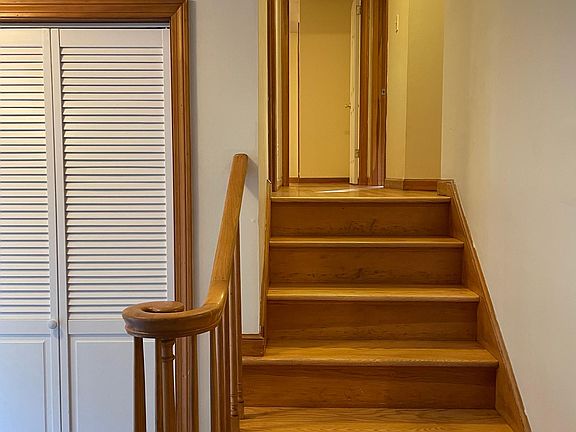 Stairway to the three upstairs bedroom and separate full bathroom