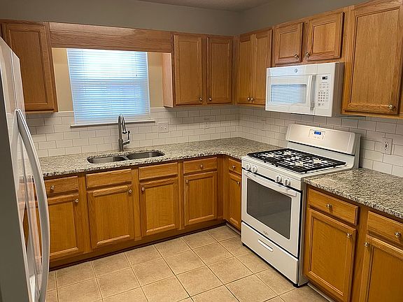 Kitchen with oak cabinets
