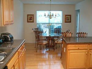 Kitchen & Breakfast area w/ hardwood floors and plenty of natural light