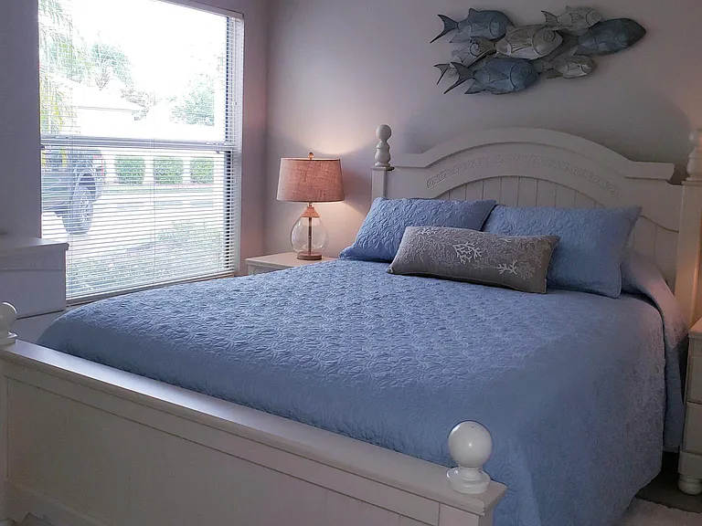 Queen size bed in guest bedroom