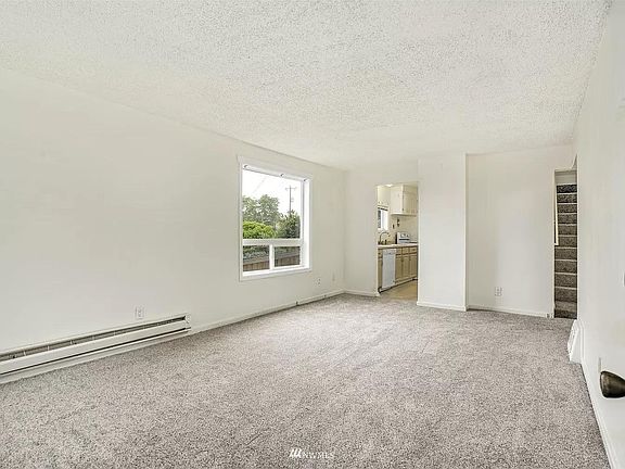 Bright living room with large windows.