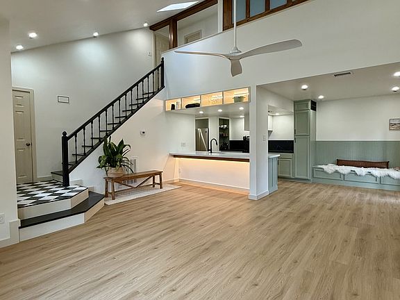 The expansive living area has plenty of room for a large couch and occasional chairs.