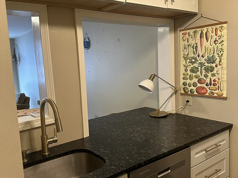 Kitchen, includes stainless steel appliances, dishwasher, microwave, and electric range.