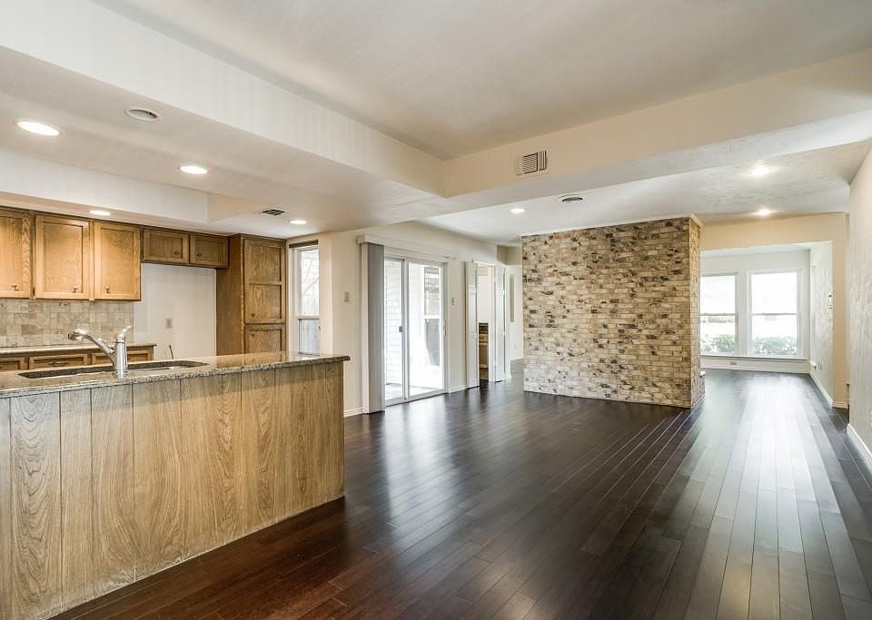 Wall removed to open up the area for a more loft style look. Bamboo flooring added.