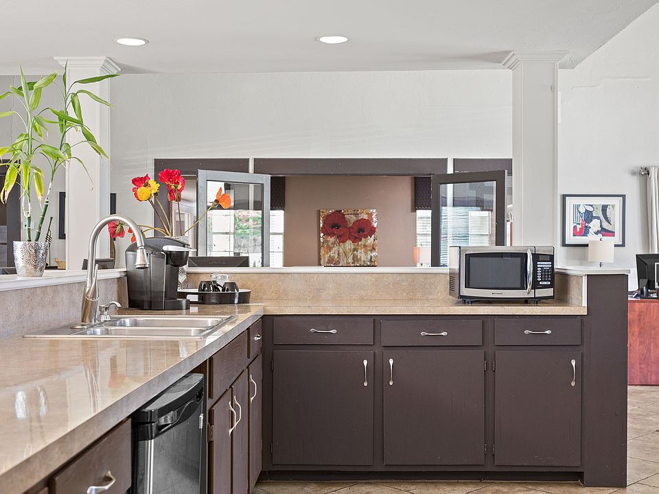 Clubhouse Community Kitchen with Coffee Maker - Raindance Apartments
