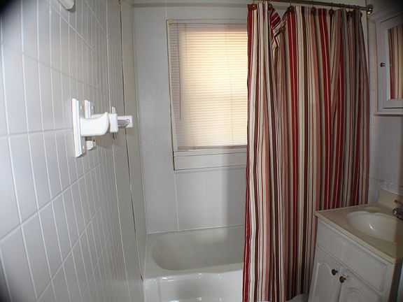 Bathroom with tub and shower.

