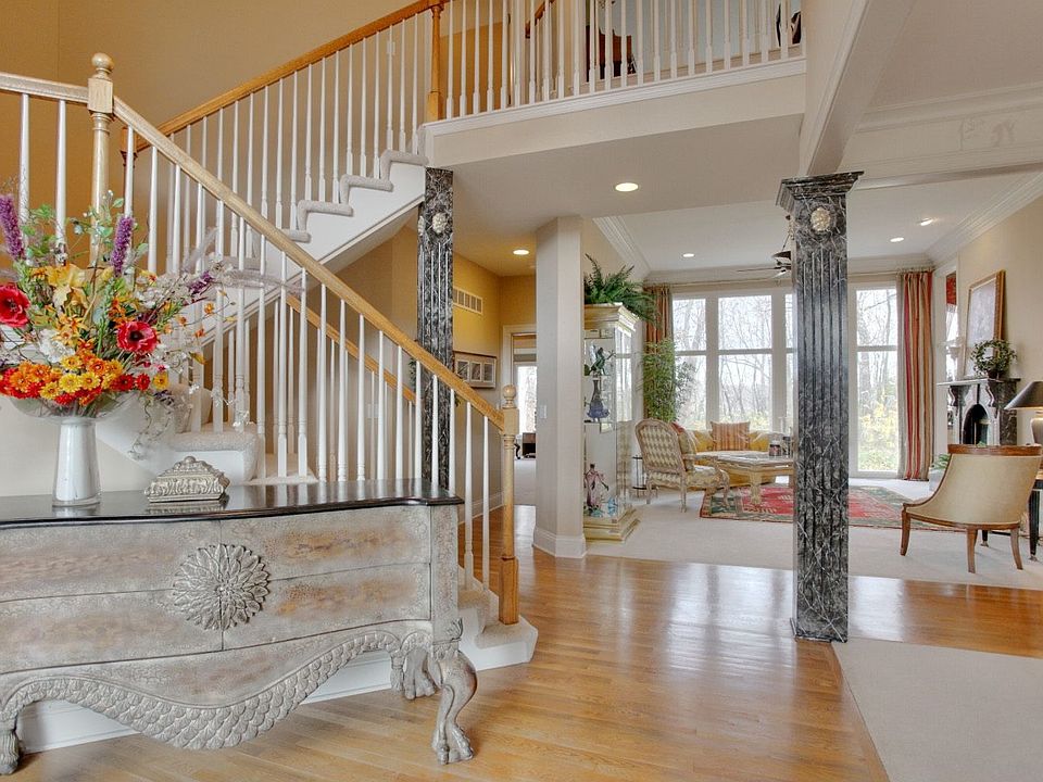 Elegant Entry w/wood floors and soaring 20 foot ceilings!