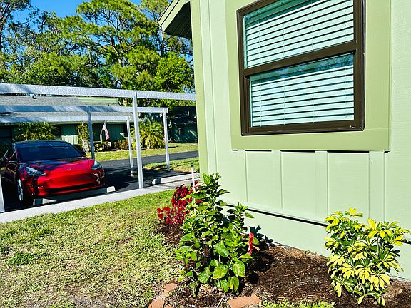 New hurricane windows. Carport covered parking space. Nice landscaping.