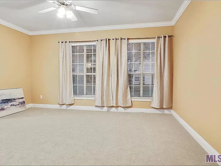 Spacious living room with big windows for natural light. Brand new carpet and fresh paint.