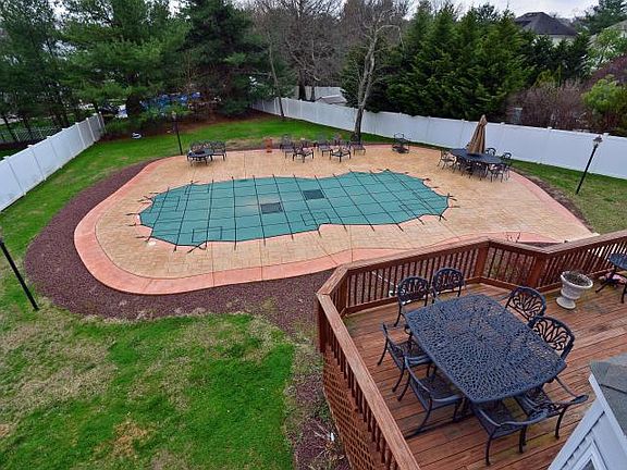 Beautiful Brick Front Colonial With In Ground Heated Pool