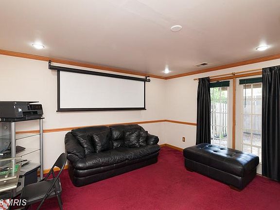 Basement Rec Room leads to backyard and garage