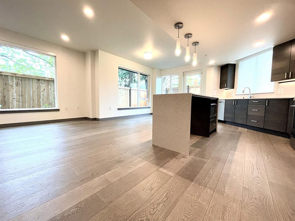 Open concept kitchen, dining, and living room