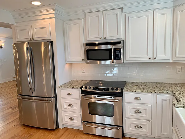 Enjoy entertaining and cooking with updated stainless steel appliances, sparkling granite countertops and shiny cabinet hardware, with plenty of cabinet space.