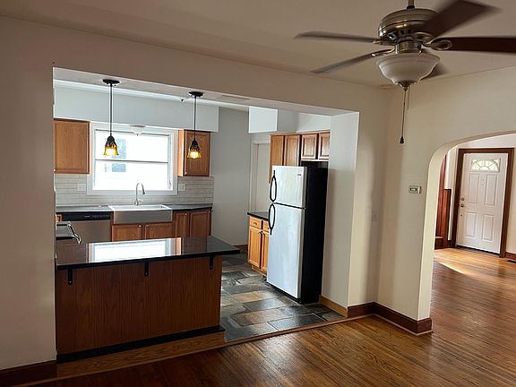 Updated kitchen, stainless steel appliances, granite countertops, tile floors