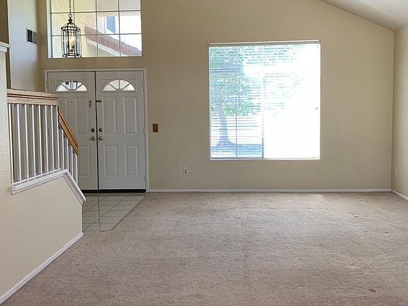 LIVING ROOM w/ VAULTED CEILINGS