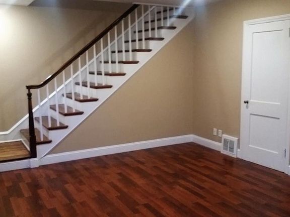 Living Room, stairs, and living room closet.