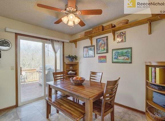 Newer storm door opens to 3 tiered deck.