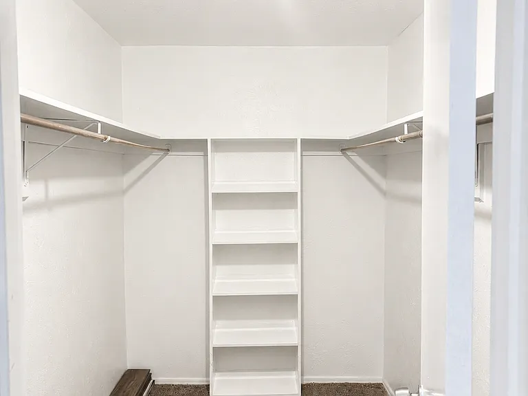 Walk-in closet for large bedroom.
