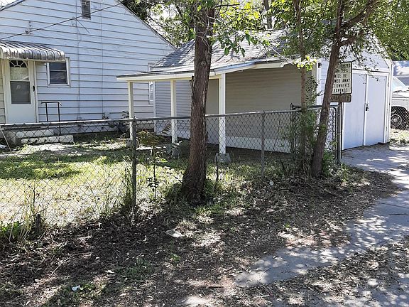 View of Back Door and Detached Garage from corner of Palisade and Boston Heights