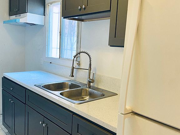 Kitchen. New cabinents, new sink, new countertops, new stove.