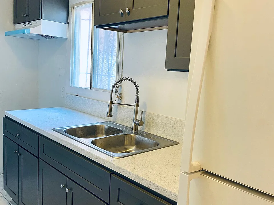 Kitchen. New cabinents, new sink, new countertops, new stove.