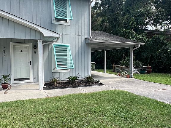 South unit to be rented, drive way and car port.