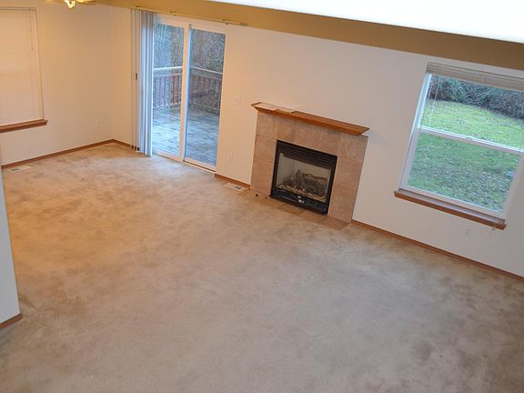 Living Room and Patio door of Unit A (remodel in progress for Unit B-all trims to be changed/laminate wood flooring/new paint/new blinds)