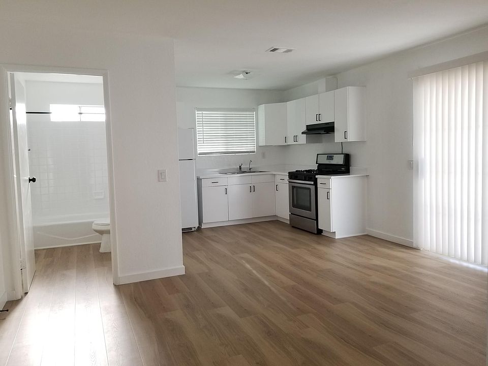 Living room, kitchen, and bathroom.