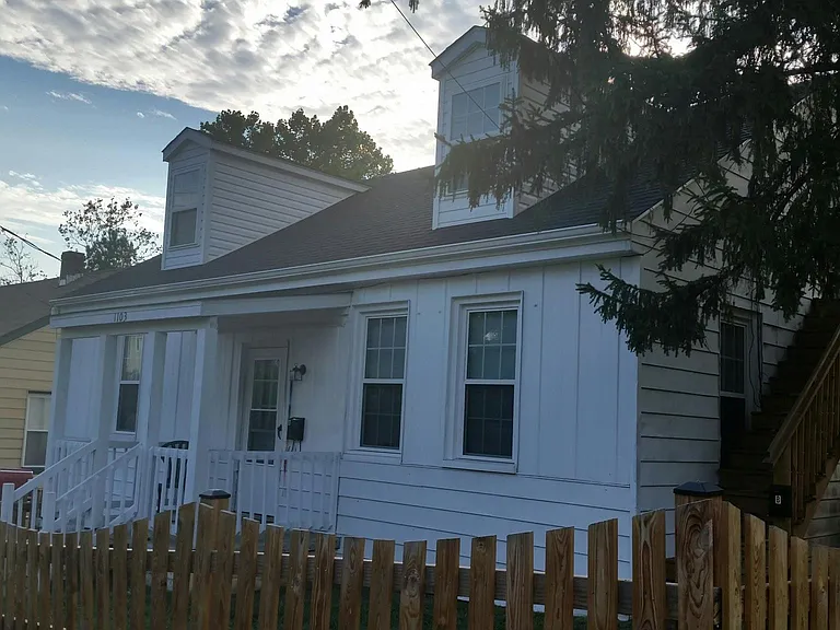 Apartment is located on the second floor of this duplex.