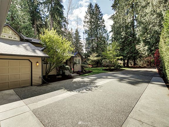 A long private drive is bordered by motion sensor lighting, welcoming you home in the evening. There is plenty of parking space for guests or an RV too.